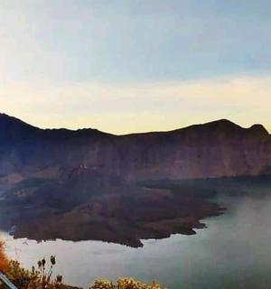 a view of a lake in the middle of a mountain