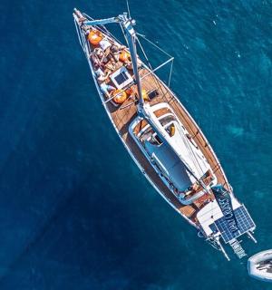 a boat with people on it in the water