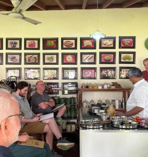 a group of people sitting at a bar in a restaurant