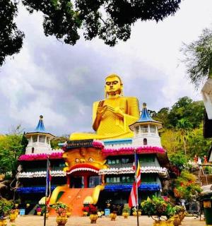 a large statue sitting on top of a building