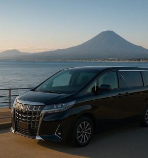 a black suv parked next to a body of water