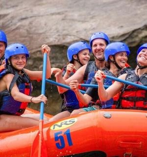a group of people are rafting on a river