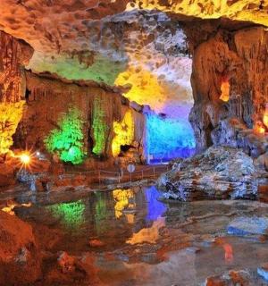 a cave with a pool of water in it