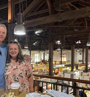 a man and a woman standing in a grocery store