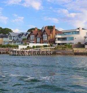 a group of houses next to a body of water