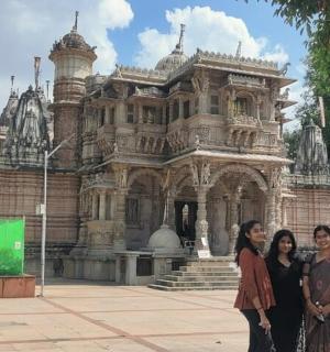 a group of people standing in front of a building