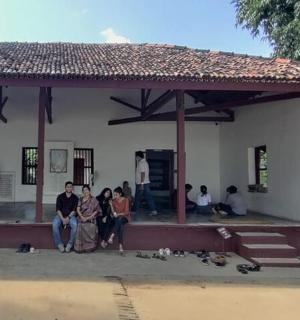 a group of people standing in front of a building