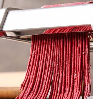 a red string hanging from a metal rack