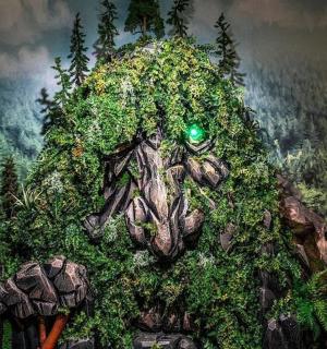 a painting of a tree stump with vegetation on it