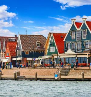 a group of colorful buildings next to a body of water