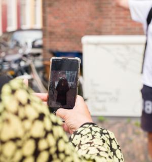a person taking a picture with a cell phone