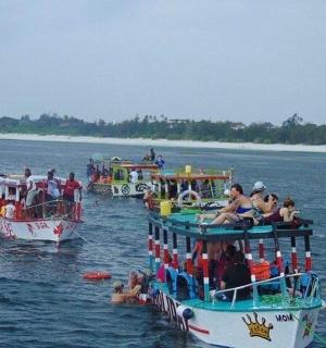 a group of people on boats in the water