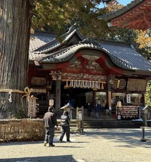 a couple of people standing in front of a temple