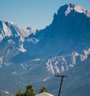 a view of a mountain range with snow covered mountains