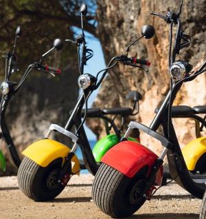 a row of scooters parked next to each other
