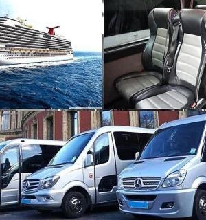 a group of vans parked next to a cruise ship