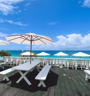 a group of tables and umbrellas on a deck