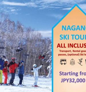 a group of skiers standing next to a sign on a ski lift