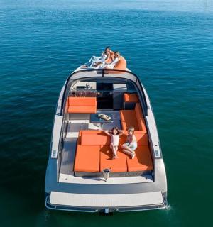 a group of people sitting on a boat in the water