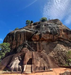 a rock formation with two elephants on it