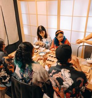 a group of people sitting around a table