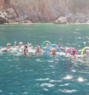 a group of people swimming in the water