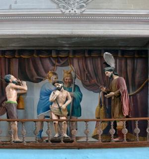 一幅画,画的是一群人在阳台上