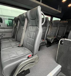 an empty seat in the back of a bus