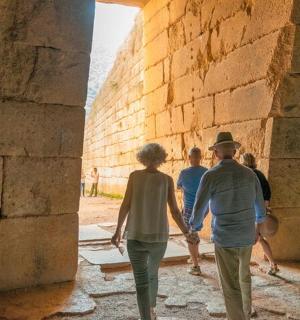 a group of people walking through an alley
