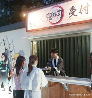 a group of people standing outside of a building