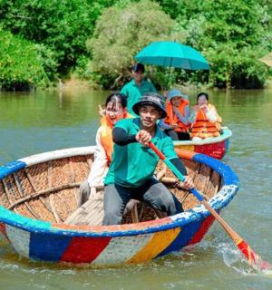 a group of people in a boat on the water