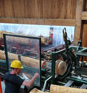 a man working on a machine in a factory