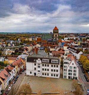 an aerial view of a city with a building