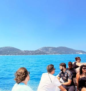 a group of people on a boat in the water