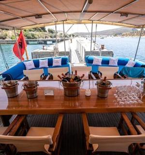 a wooden table on a boat in the water