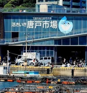 a building with a sign on it next to the water