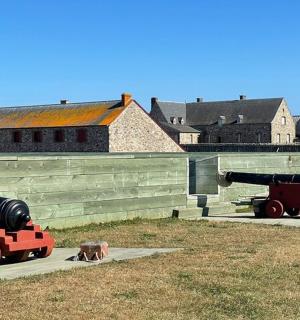 two toy trains on display in front of a building