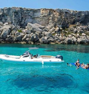 a group of people on a boat in the water