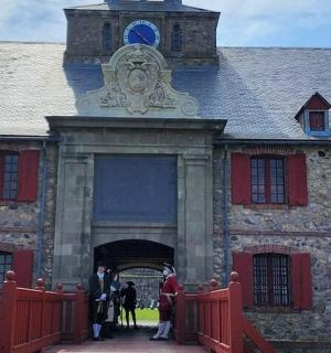 a group of people standing in front of a building
