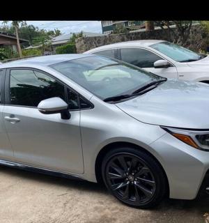 a white car parked in a parking lot
