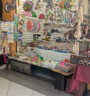 a woman is standing in a store with a display