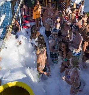 a group of people in the water on a boat