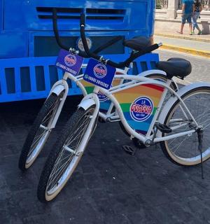 a bike is parked next to a bus
