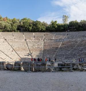 a group of people standing in an amphitheater