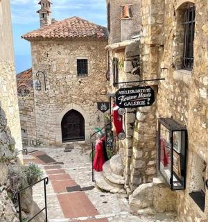 a stone building with a street sign on it