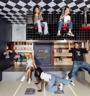 a group of people sitting on a shelf in a room