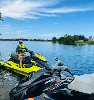 a man is sitting on a jet ski in the water
