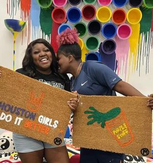 a man and a woman holding up a sign