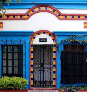 a blue and white house with two doors
