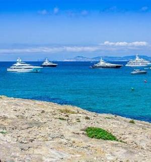 a group of boats floating in the water